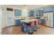 Stylish kitchen with blue cabinets, stainless steel appliances, and quartz countertops at 866 W Hereford Dr, San Tan Valley, AZ 85143