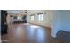 Expansive living room featuring tile floors, lots of windows, and an open floor plan to the kitchen at 866 W Hereford Dr, San Tan Valley, AZ 85143