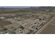 An aerial view shows layout of the land and nearby surrounding desert landscape at 9066 N Thunderbird Rd, Maricopa, AZ 85139