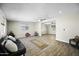 Open-concept living space with wood-look floors and a seamless flow between rooms at 9066 N Thunderbird Rd, Maricopa, AZ 85139