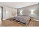 Spacious main bedroom features wood floors, a closet, neutral paint, and ample natural light at 934 S Roslyn Pl, Mesa, AZ 85208