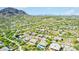 Scenic aerial shot displays desert homes complemented by private pools and desert vegetation against a backdrop of hills at 11743 E Desert Vista Dr, Scottsdale, AZ 85255