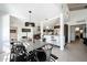 Well-lit dining room featuring modern light fixture, industrial-style dining set, and an open concept design at 1217 W Campbell Ave, Phoenix, AZ 85013