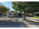 Charming single-story home with desert landscaping and mature shade trees at 1217 W Campbell Ave, Phoenix, AZ 85013