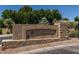 Decorative entrance sign with lush landscaping welcomes you to Enclave Villas at 1225 N 36Th St # 2091, Phoenix, AZ 85008