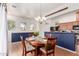 Dining space featuring a wood table and an adjacent kitchen area at 1225 N 36Th St # 2091, Phoenix, AZ 85008