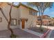 Inviting home with desert landscaping, a covered entry, and multiple windows at 1225 N 36Th St # 2091, Phoenix, AZ 85008