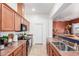 Kitchen featuring stainless appliances, light-colored cabinets, and tile flooring at 1225 N 36Th St # 2091, Phoenix, AZ 85008