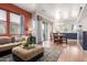 Open concept living room featuring modern lighting and an adjacent dining area at 1225 N 36Th St # 2091, Phoenix, AZ 85008