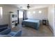 Comfortable bedroom featuring a ceiling fan, two armchairs, and natural light at 1349 E Dunbar Dr, Phoenix, AZ 85042