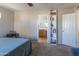 Bedroom view towards a bathroom, showcasing a double sink vanity and neutral tones at 1349 E Dunbar Dr, Phoenix, AZ 85042