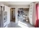 Bedroom featuring carpet, shelves, and closet with clothes and storage baskets at 1349 E Dunbar Dr, Phoenix, AZ 85042