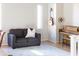 Comfortable living room showcasing sofa, guitar, piano, and decorative rug at 1349 E Dunbar Dr, Phoenix, AZ 85042