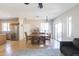 Bright living room with dining area, hardwood floors, and a stainless steel refrigerator at 1349 E Dunbar Dr, Phoenix, AZ 85042