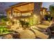 Beautiful backyard with stone patio, mature trees, and water feature offers an outdoor oasis at 15827 E Firerock County Club Dr, Fountain Hills, AZ 85268
