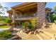 Expansive backyard with a patio, lush landscaping, and a unique stone staircase and water feature at 15827 E Firerock County Club Dr, Fountain Hills, AZ 85268