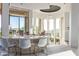 Stylish bar area with stone accents, marble countertop, and scenic outdoor views at 15827 E Firerock County Club Dr, Fountain Hills, AZ 85268