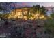 Elegant home with desert landscaping creates a serene outdoor living space for relaxing and enjoying the environment at 15827 E Firerock County Club Dr, Fountain Hills, AZ 85268