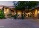 Stunning home featuring a private courtyard and grand entryway with stone accents and manicured landscaping at 15827 E Firerock County Club Dr, Fountain Hills, AZ 85268