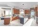 Bright gourmet kitchen featuring an island, premium appliances, and stylish stone accents at 15827 E Firerock County Club Dr, Fountain Hills, AZ 85268