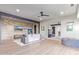 Large living room with exposed beams, stone accent wall, and hard wood flooring at 15827 E Firerock County Club Dr, Fountain Hills, AZ 85268