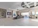 Bright and airy living room with stone fireplace, neutral decor, and expansive views at 15827 E Firerock County Club Dr, Fountain Hills, AZ 85268
