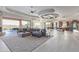 Expansive living room boasts an open layout, tile floors, fireplace, and access to outdoor patio with views at 15827 E Firerock County Club Dr, Fountain Hills, AZ 85268