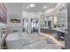 Elegant bathroom featuring a soaking tub, dual vanities, and modern fixtures, creating a luxurious retreat at 15827 E Firerock County Club Dr, Fountain Hills, AZ 85268