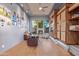 Bright office featuring hardwood floors, a custom cabinet, and a stone fireplace that offers an inviting workspace at 15827 E Firerock County Club Dr, Fountain Hills, AZ 85268