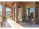 Covered patio with stylish seating provides stunning views, perfect for outdoor relaxation and entertainment at 15827 E Firerock County Club Dr, Fountain Hills, AZ 85268
