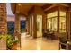 Covered patio with stone columns, offering stunning views of the surrounding landscape and providing a relaxing retreat at 15827 E Firerock County Club Dr, Fountain Hills, AZ 85268