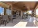 Covered patio with a dining area and a comfortable seating area, perfect for outdoor entertaining at 15827 E Firerock County Club Dr, Fountain Hills, AZ 85268