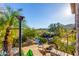 Backyard with an infinity pool, lush foliage, and a serene view of the surrounding landscape at 15827 E Firerock County Club Dr, Fountain Hills, AZ 85268