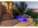 Inviting spa pool with waterfall feature and landscape design adds a sense of luxury at 15827 E Firerock County Club Dr, Fountain Hills, AZ 85268