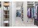 Spacious walk-in closet features custom shelving and ample storage for clothing and accessories at 15827 E Firerock County Club Dr, Fountain Hills, AZ 85268