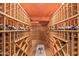 Stunning temperature-controlled wine cellar with wooden racks offers ample storage for the wine enthusiast at 15827 E Firerock County Club Dr, Fountain Hills, AZ 85268
