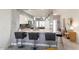 Modern eat-in kitchen with stainless steel appliances and stylish breakfast bar seating at 15876 W Alpine Ridge Dr, Surprise, AZ 85374