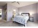 Spacious main bedroom with lilac walls, a walk-in closet, and an en-suite bathroom at 15876 W Alpine Ridge Dr, Surprise, AZ 85374