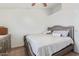 Bedroom with a silver dresser, padded headboard and decorative pillows at 1601 N Saba St # 264, Chandler, AZ 85225