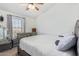 Bedroom with a silver dresser, ottoman and decorative pillows at 1601 N Saba St # 264, Chandler, AZ 85225