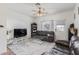 Comfortable living room with ceiling fan, neutral walls, and plush gray rug with modern furniture at 1601 N Saba St # 264, Chandler, AZ 85225