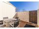 Outdoor patio space features a table with four chairs, a brick wall, and private fencing at 1601 N Saba St # 264, Chandler, AZ 85225