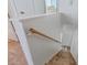 Carpeted staircase with wooden handrail leading to the lower level at 1601 N Saba St # 264, Chandler, AZ 85225