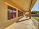 Spacious covered patio with views of the backyard and the surrounding desert neighborhood at 16247 W Desert Mirage Dr, Surprise, AZ 85379