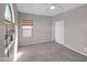 Bedroom featuring carpeted floors and a white closet at 16247 W Desert Mirage Dr, Surprise, AZ 85379