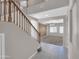Inviting entryway featuring a staircase and an open view into the spacious living area beyond at 16247 W Desert Mirage Dr, Surprise, AZ 85379