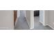 Hallway with carpet, paint and door openings at 16247 W Desert Mirage Dr, Surprise, AZ 85379