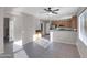 View of living room to kitchen featuring tile floors at 16247 W Desert Mirage Dr, Surprise, AZ 85379