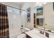 Bathroom featuring a bathtub with shower, toilet, sink, vanity and decor at 1646 N Channing --, Mesa, AZ 85207