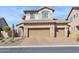 Charming two-story home featuring a three-car garage and desert landscaping at 1646 N Channing --, Mesa, AZ 85207